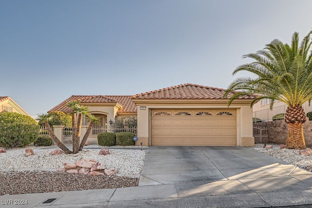 mediterranean / spanish-style home featuring a garage