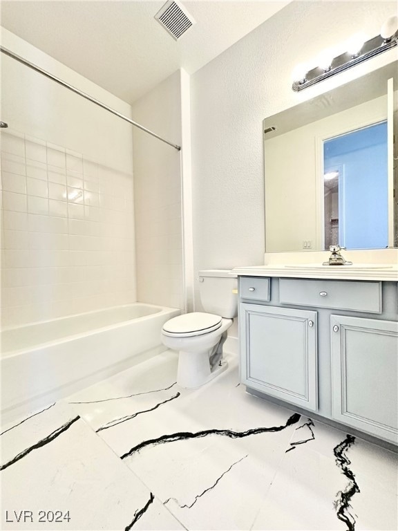 full bathroom with vanity, toilet, and tiled shower / bath combo