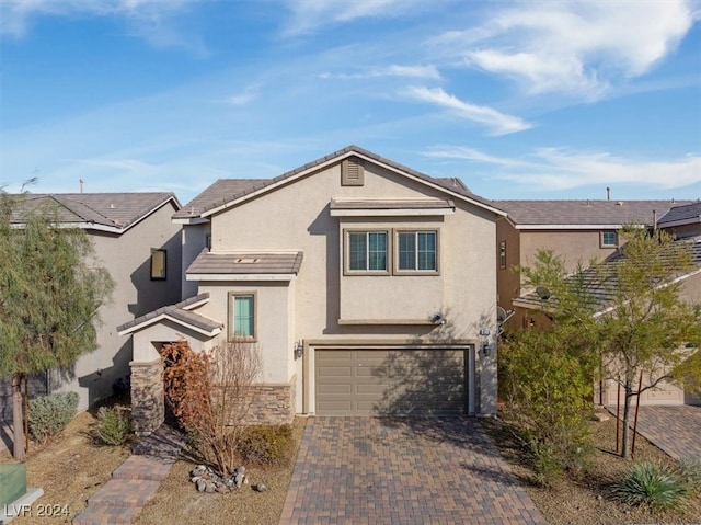 view of front of property with a garage