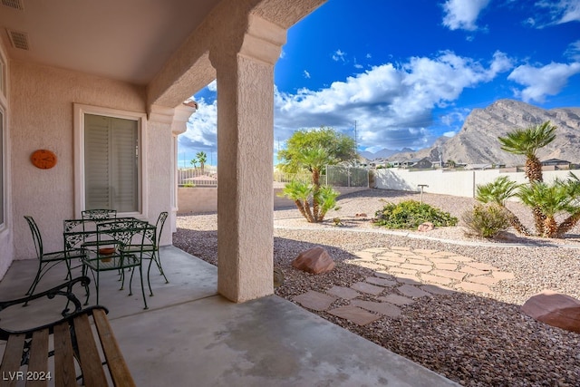 view of patio with a mountain view