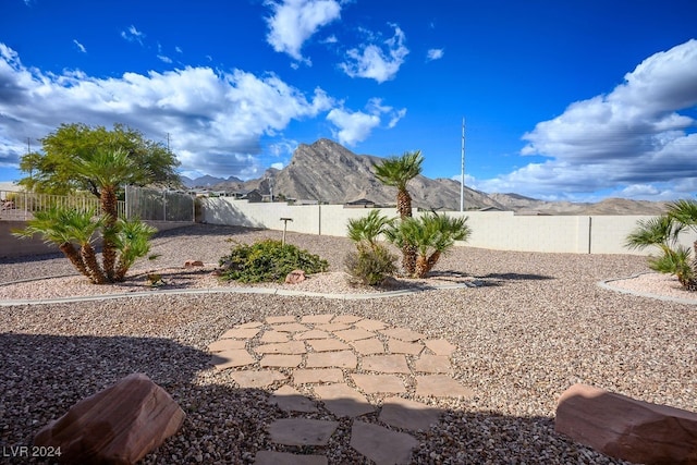 view of yard featuring a mountain view and a patio area