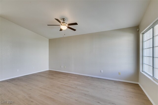 unfurnished room with light hardwood / wood-style floors and ceiling fan