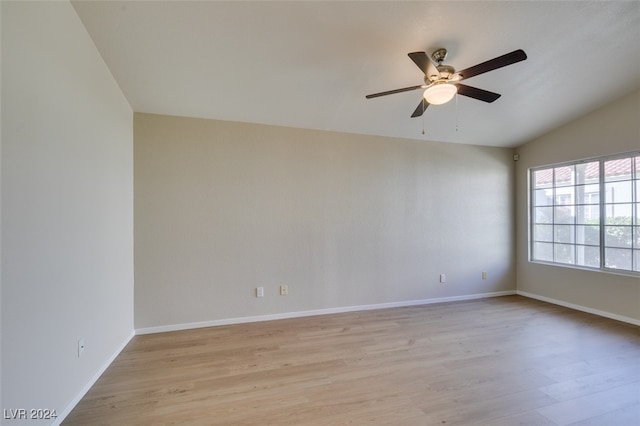 unfurnished room with lofted ceiling, light hardwood / wood-style flooring, and ceiling fan