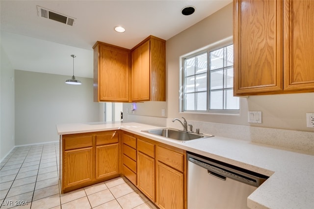 kitchen featuring sink, dishwasher, kitchen peninsula, hanging light fixtures, and light tile patterned floors