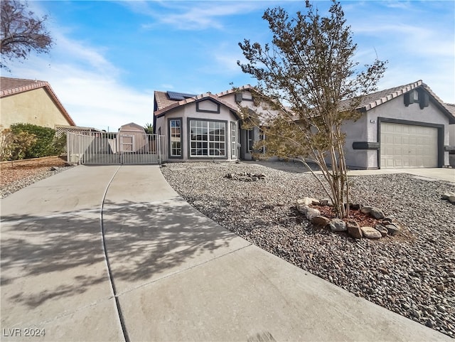 ranch-style home featuring a garage