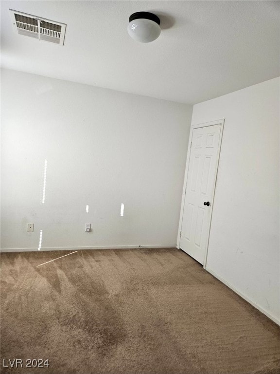 empty room featuring carpet