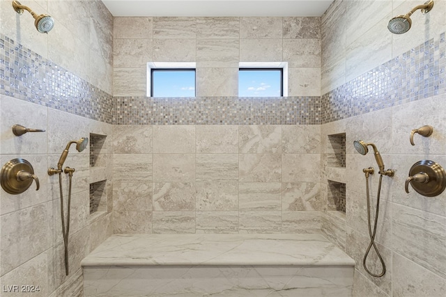 bathroom with tiled shower