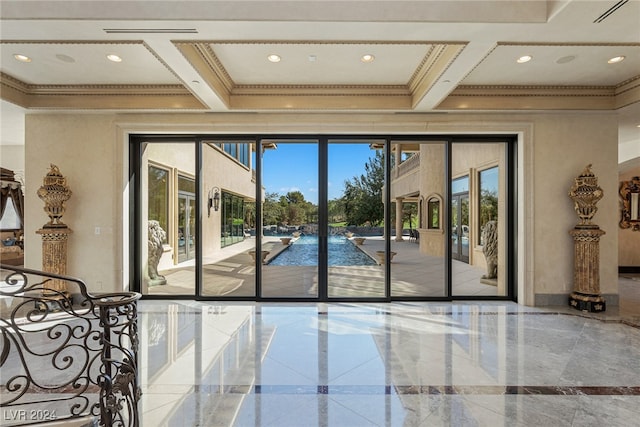 entryway featuring beam ceiling, ornamental molding, and coffered ceiling