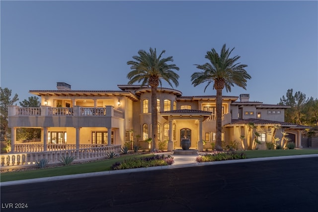 mediterranean / spanish-style home with a balcony