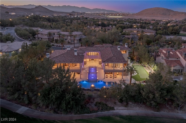 aerial view at dusk with a mountain view