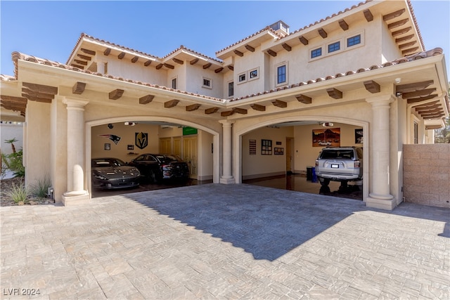 mediterranean / spanish-style home featuring a carport