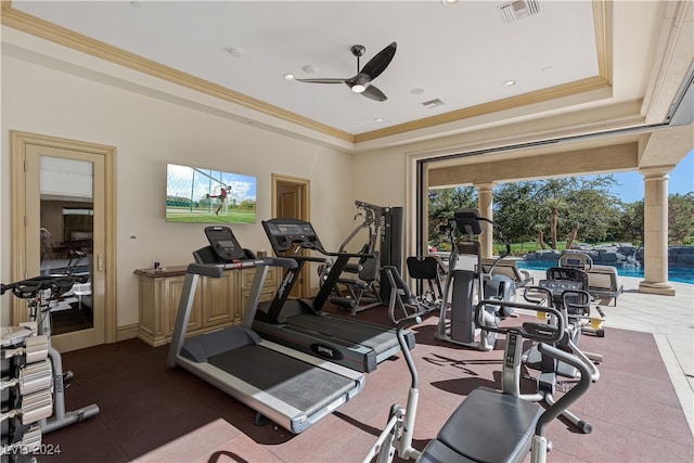 exercise room with crown molding, a healthy amount of sunlight, and ceiling fan