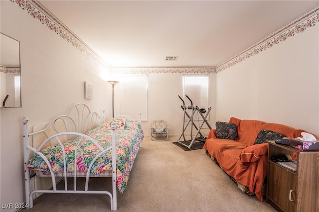 bedroom with crown molding, multiple windows, and carpet floors