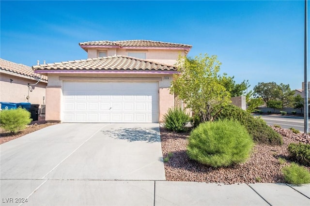 5516 Madigan Ct, Las Vegas, NV 89118 - mediterranean / spanish-style home featuring stucco siding, driveway, a garage, and a tiled roof