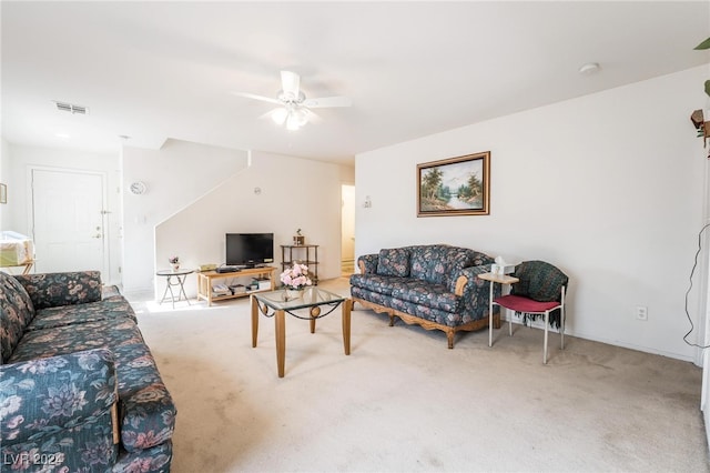 living room featuring carpet flooring and ceiling fan