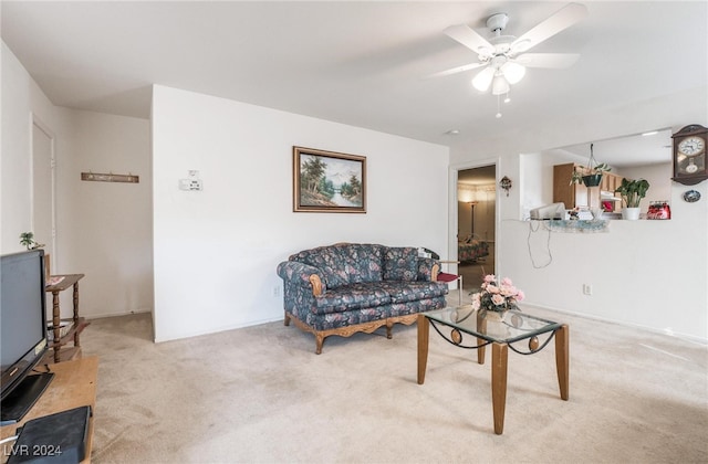 living room featuring light carpet and ceiling fan