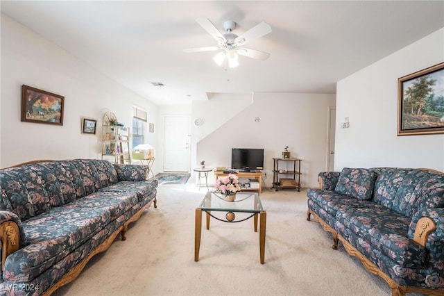 carpeted living room featuring ceiling fan