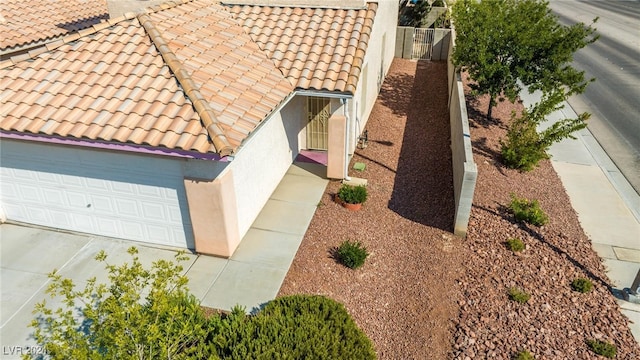 view of side of home with a garage