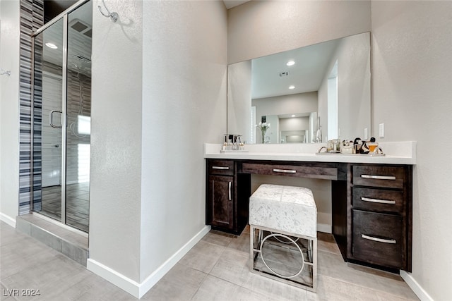 bathroom featuring vanity, tile patterned flooring, and an enclosed shower