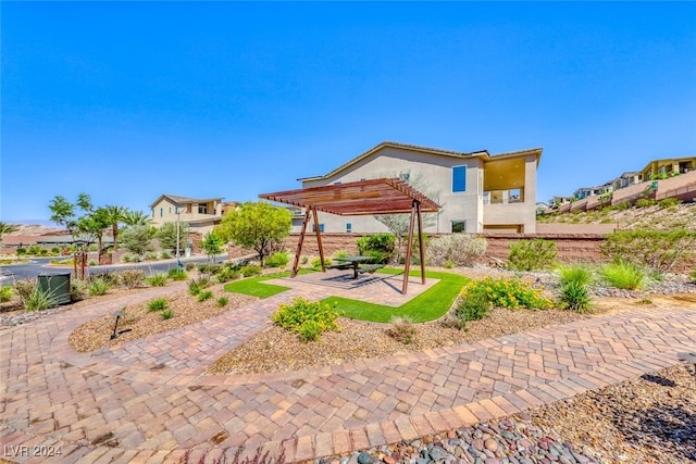 view of yard with a patio and a pergola