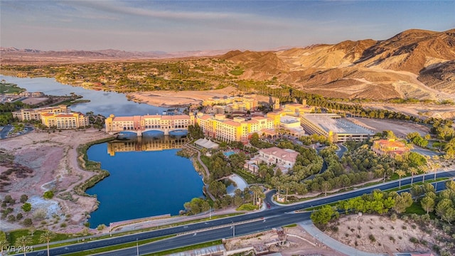 aerial view at dusk with a water and mountain view