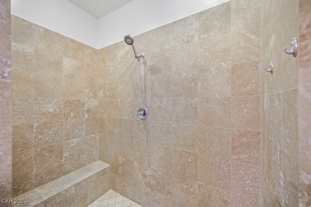 bathroom with tiled shower