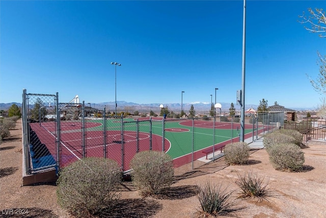 view of sport court with a mountain view