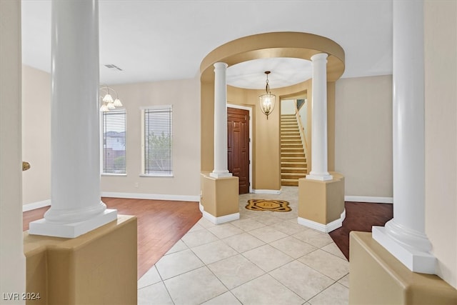 entryway with a chandelier and light wood-type flooring