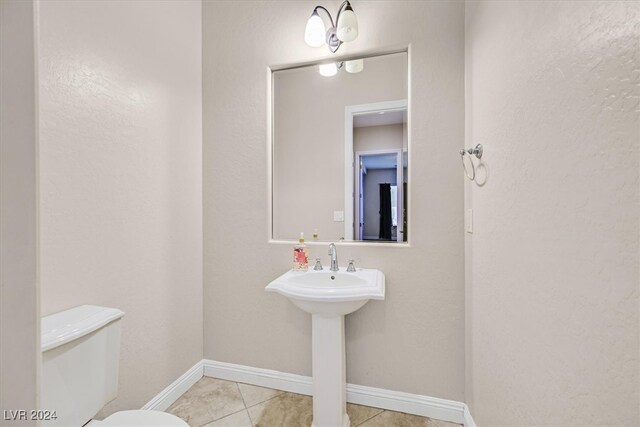 bathroom with tile patterned floors and toilet