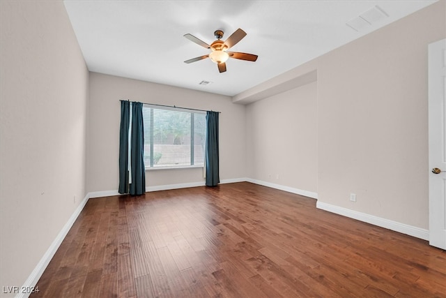 spare room featuring hardwood / wood-style flooring and ceiling fan