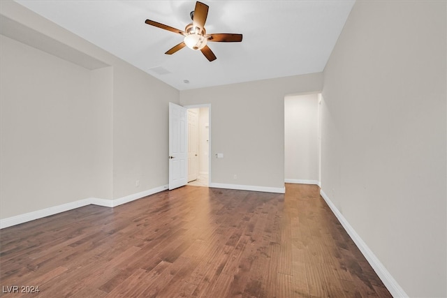 empty room with wood-type flooring and ceiling fan