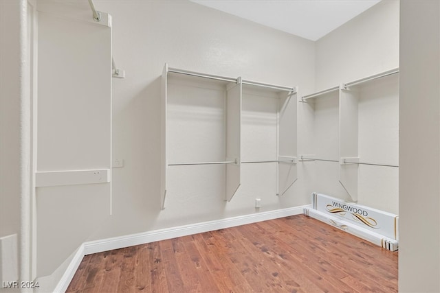 walk in closet featuring hardwood / wood-style flooring