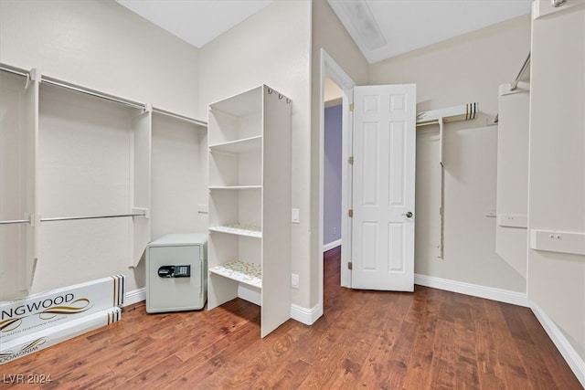 spacious closet with dark hardwood / wood-style floors