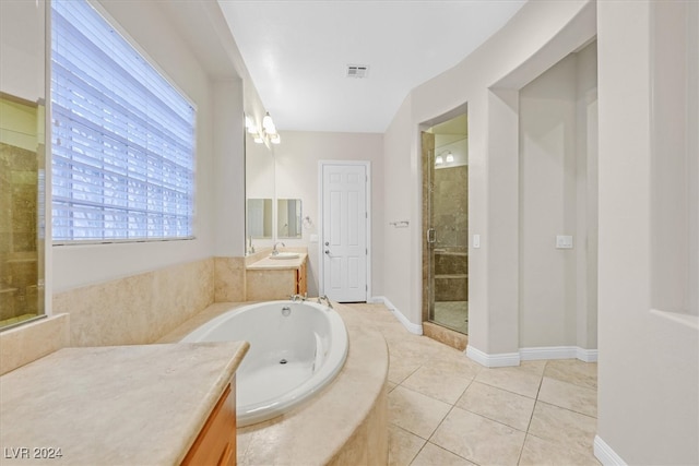 bathroom with vanity, separate shower and tub, and tile patterned flooring