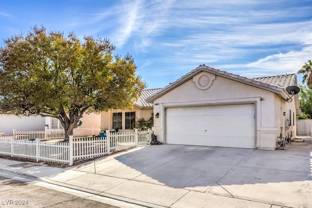 ranch-style home featuring a garage