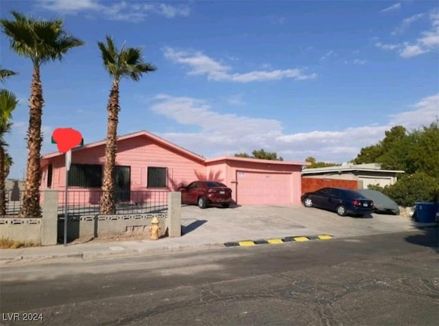 ranch-style home featuring a garage