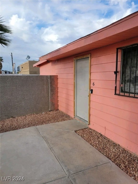 property entrance with a patio