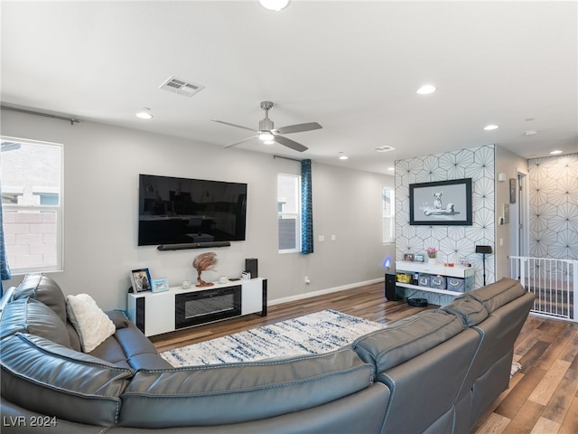 living room with hardwood / wood-style floors and ceiling fan