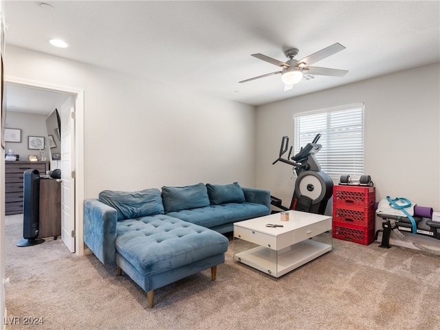 living room with ceiling fan and carpet floors