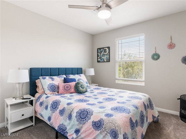 bedroom featuring dark carpet and ceiling fan