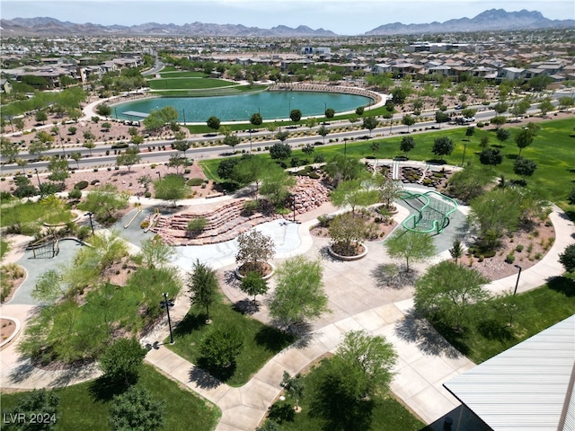 birds eye view of property featuring a water and mountain view