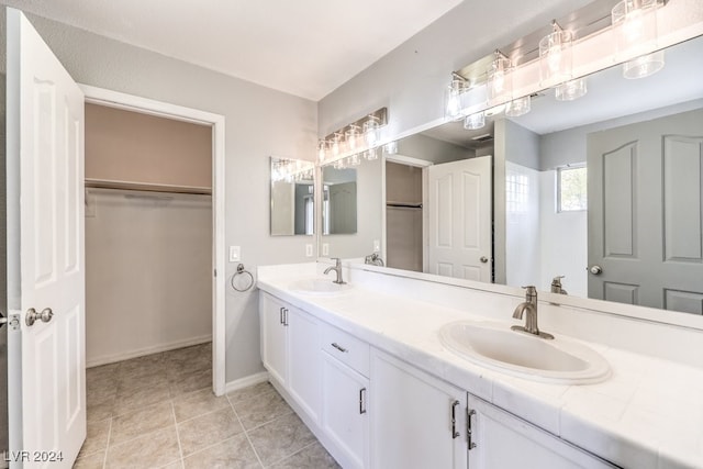 bathroom featuring tile patterned floors and vanity