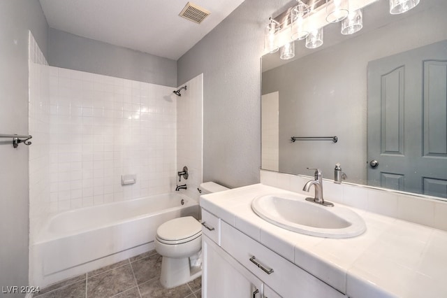 full bathroom featuring shower / tub combination, tile patterned floors, vanity, and toilet