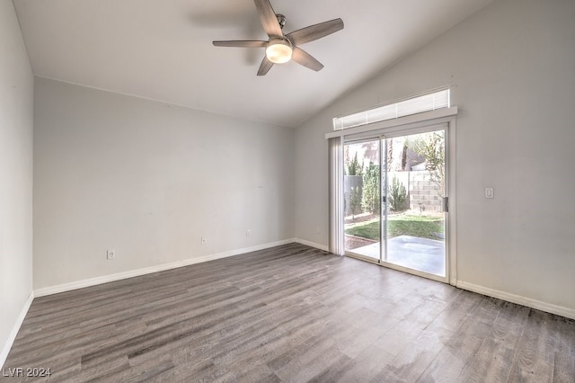 unfurnished room featuring dark wood-type flooring, ceiling fan, and lofted ceiling