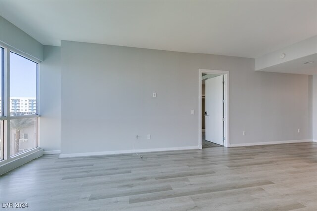 unfurnished room featuring light hardwood / wood-style floors