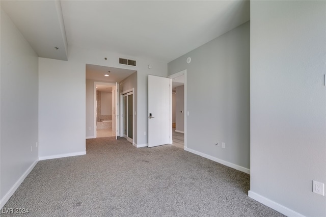 unfurnished room featuring carpet flooring