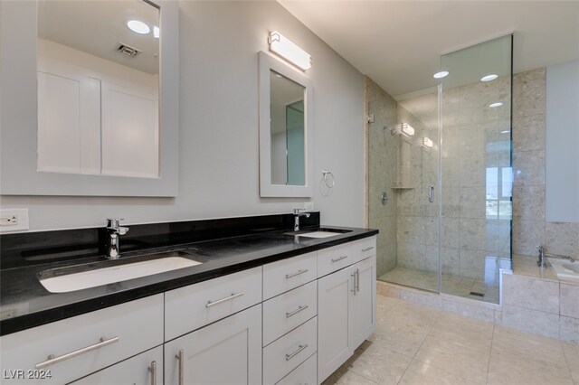 bathroom featuring vanity, tile patterned floors, and plus walk in shower