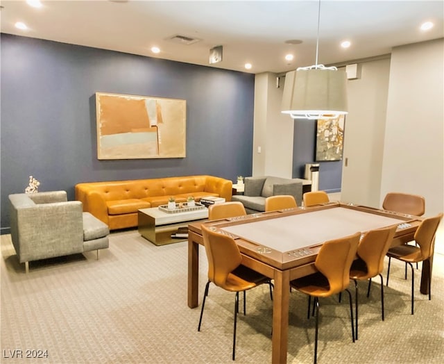 view of carpeted dining area