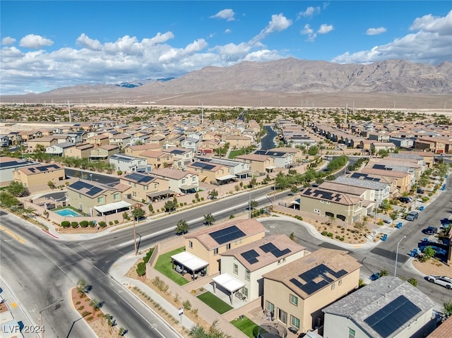 birds eye view of property featuring a mountain view