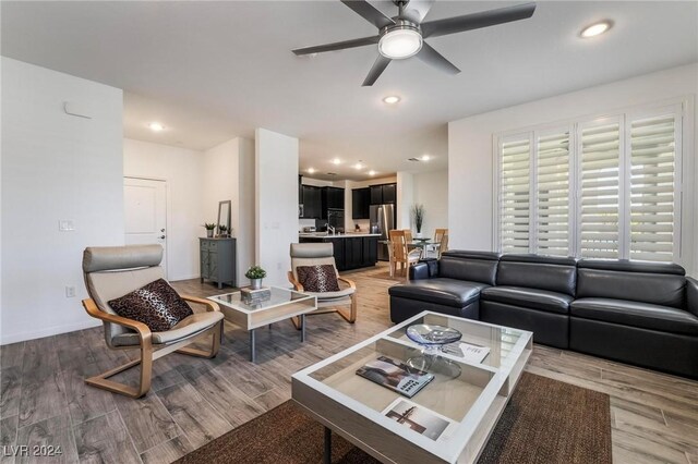 living room featuring ceiling fan